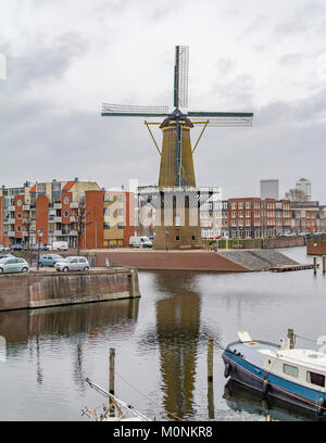 scenery with historic windmill around the Old Port in Rotterdam, a city in the Netherlands Stock Photo