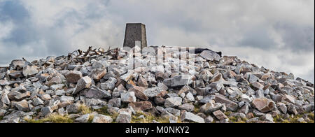 Cairn and trig point at the top of Cnoc Fola, Bloody Foreland, County Donegal, ireland Stock Photo