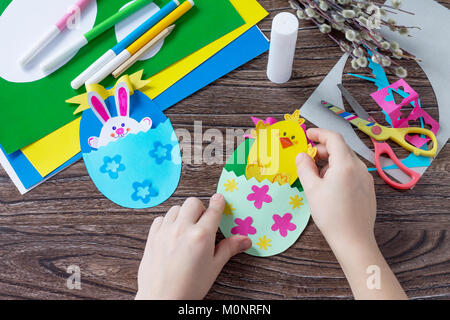 Children's easter egg gift with toy chicken and easter bunny. Handmade. Project of children's creativity, handicrafts, crafts for kids. Stock Photo