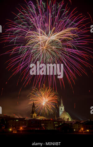Fireworks over Schwaz on New Year's Eve with hospital church and parish church,Schwaz,Tyrol,Austria Stock Photo