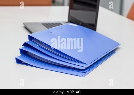 File folder with Documents and Notebook background on white table in meeting room - concept business Stock Photo