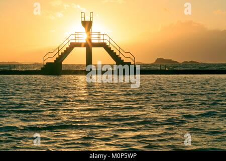 France,Ille et Vilaine,Saint Malo,silhouette of the plunger of good help,beach of good help,natural swimming pool,at low tide at sunset Stock Photo