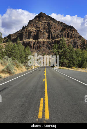 The highway through the John Day Fossil Beds in Wheeler County, Oregon. Stock Photo