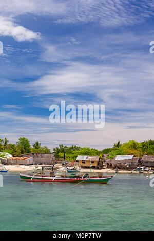 Philippines,Palawan,Roxas,Green Island Bay,Shell Island,boat in front of a fishermen village Stock Photo