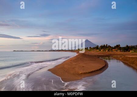 Philippines,Luzon,Albay Province,Tiwi,sunrise on the beach with Mayon volcano in back ground Stock Photo