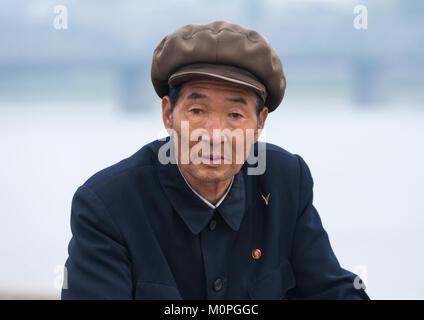 Portrait of senior North Korean man with a cap, Pyongan Province, Pyongyang, North Korea Stock Photo