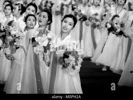 North Korean women dancing in choson-ot during the Arirang mass games in may day stadium, Pyongan Province, Pyongyang, North Korea Stock Photo