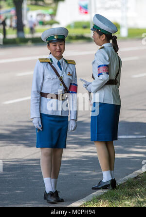 North Korean traffic security officers in white uniforms in the street, Pyongan Province, Pyongyang, North Korea Stock Photo