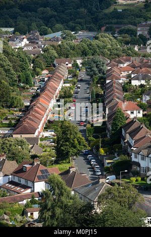High view of area of Baildon town, with straight road of semi-detached houses in residential urban suburb - Bradford, West Yorkshire, England, UK. Stock Photo