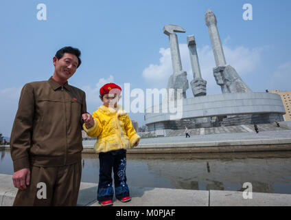 North Korean father and daughter near monument to Party founding, Pyongan Province, Pyongyang, North Korea Stock Photo