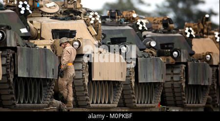 Marines with 2nd Tank Battalion, 2nd Marine Division secure M1A1 battle tanks to train cars for transport to Fort Stewart, Ga., for a training exercise Jan. 22, 2017 on Marine Corps Base Camp Lejeune, N.C. Stock Photo