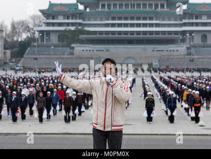 Young North Korean women during a mass games rehearsal in Kim il Sung square, Pyongan Province, Pyongyang, North Korea Stock Photo