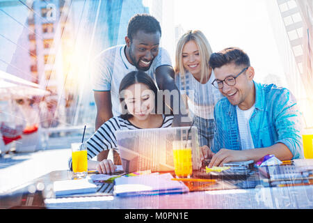 Positive friends having adorable time together Stock Photo