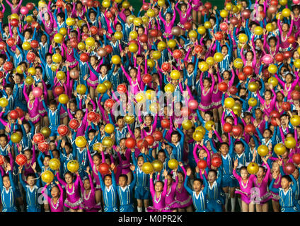 North Korean children performing with balloons during the Arirang mass games in may day stadium, Pyongan Province, Pyongyang, North Korea Stock Photo