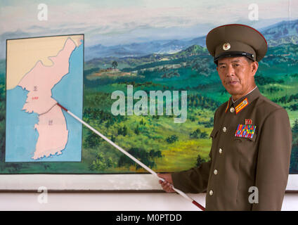 North Korean soldier in the joint security area in front of the map of Korea, North Hwanghae Province, Panmunjom, North Korea Stock Photo