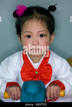 North Korean girl dressed in choson-ot in an orphanage, South Pyongan Province, Nampo, North Korea Stock Photo