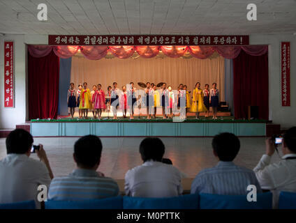 North Korean girl singing during a show for toursist in a school, Pyongan Province, Pyongyang, North Korea Stock Photo
