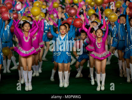 North Korean children performing with balloons during the Arirang mass games in may day stadium, Pyongan Province, Pyongyang, North Korea Stock Photo