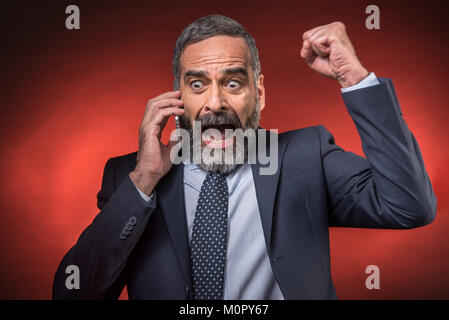 Amazing news for a senior business man Stock Photo