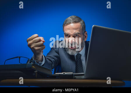 Mad, unhappy boss threatening Stock Photo