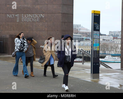 London, UK. 24th Jan, 2018. Commuters carry on at London Bridge despite very wet and blustery conditions with wind speeds of up to 50MPH forecast until later today Credit: Keith Larby/Alamy Live News Stock Photo