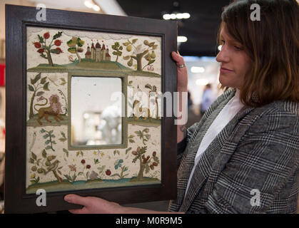 Battersea Park, London, UK. 24 January 2018. The Decorative Antiques and Textiles Fair is open at Battersea Park through 28 January 2018. Inglis Hall Antiques, contemporary stump work embroidery mirror border made by Didie Inglis Hall, 2016. Credit: Malcolm Park/Alamy Live News. Stock Photo