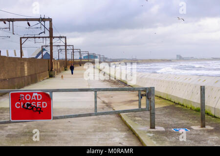 Saltcoats, Scotland, UK. 24th January  2018. UK Weather: Strong winds hit Ayrshire coast causing waves to crash against the sea wall. The road is closed for safety reasons. Storm Georgina is the seventh named storm of the season and is forecast to bring high wind and rain sweeping easterly across Britain. Credit: Skully/Alamy Live News Stock Photo