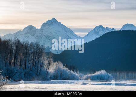 Chilkat River and Mountains in snow on a sunrise. Alaska.USA Stock Photo