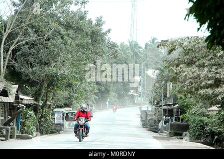 Daraga, Albay, Philippines. 23rd Jan, 2018. The main road full of volcanic ash fall all over the place inside the danger zone in Brgy. Masurawag, Guinobatan, Albay. The whole town becomes ghost town after the forces evacuation implemented the local government after the Philippine Institute of Volcanology and Seismology (PHILVOLCS) declared alert number 4 and wider the danger zone to 8 kilometers area after explosions with volcanic ash yesterday (January 22, 2018). Credit: PACIFIC PRESS/Alamy Live News Stock Photo