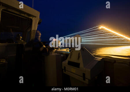 MEDITERRANEAN SEA (January 19, 2018) A sailor aboard Standing NATO Maritime Group Two (SNMG2) flagship, Royal Navy destroyer HMS Duncan, conducts small arms training at sea as part of the upper deck weapons team. SNMG2 is one of four NATO multi-national maritime groups on constant patrol, ready to support NATO requirements. NATO Stock Photo