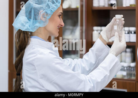 Woman chemist finding the perfect substance during experimental  Stock Photo