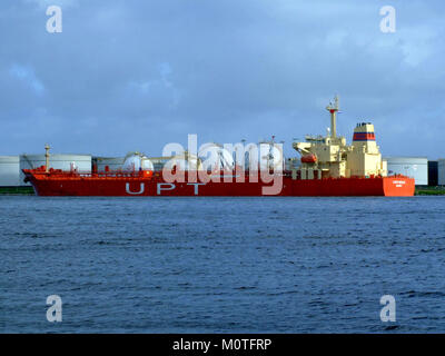 The Cape Beale, IMO number 9288928, a cargo ship, is docked at the Port of Amsterdam, Holland, on January 30, 2005. The image shows the ship in port during a routine stop, reflecting the maritime industry and global shipping operations. Stock Photo