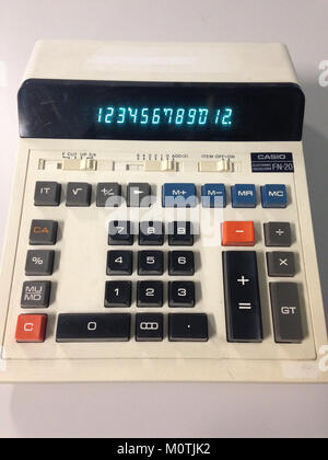 The Casio FN-20 electronic calculator, introduced in the 1970s, is a compact and functional calculator known for its practical design and usability. It represents the technological advancements of the time in electronic devices. Stock Photo