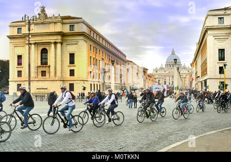 Large group of cyclists cycling past Via della Conciliazione and the Vatican Stock Photo