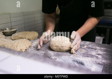 Artisan baker making bread Stock Photo