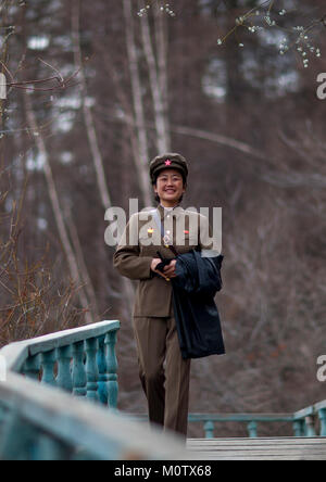 Portrait of a smiling North Korean guide in mount Paektu, Ryanggang Province, Rimyongsu, North Korea Stock Photo