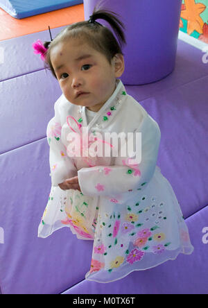 North Korean girl dressed in choson-ot in an orphanage, South Pyongan Province, Nampo, North Korea Stock Photo