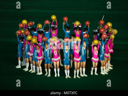 North Korean children performing with balloons during the Arirang mass games in may day stadium, Pyongan Province, Pyongyang, North Korea Stock Photo