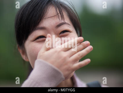 Portrait of a shy North Korean woman, Pyongan Province, Pyongyang, North Korea Stock Photo