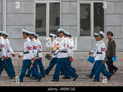 Group of North Korean male traffic security officers in white uniforms in the street, Pyongan Province, Pyongyang, North Korea Stock Photo