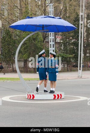 North Korean female traffic security officers in blue uniforms, Pyongan Province, Pyongyang, North Korea Stock Photo