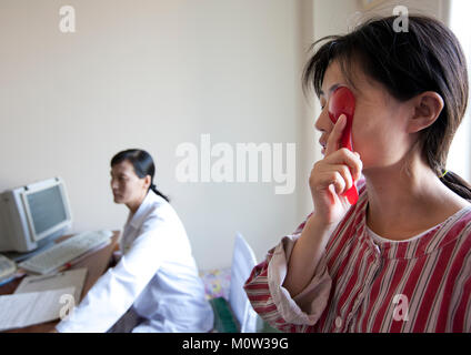 North Korean woman taking eye exam in an hospital, Pyongan Province, Pyongyang, North Korea Stock Photo