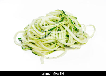 Raw zucchini noodles in a stack isolated on white Stock Photo