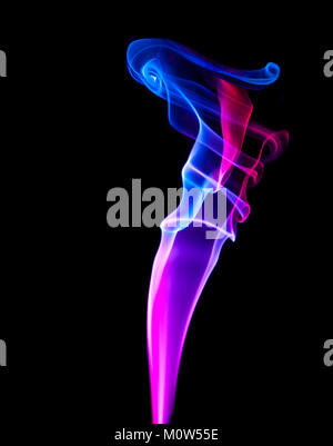 An isolated vertical column of coloured smoke showing red and purple hues having both scientific and artistic appeal as well as black copy space Stock Photo