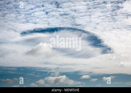 Image of rare Fallstreak holes formed in cirrocumulus and altocumulus clouds in Wiltshire. Stock Photo