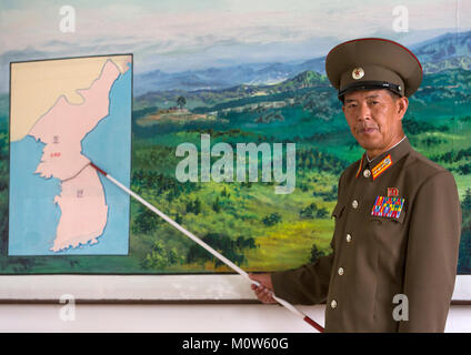 North Korean soldier in the joint security area in front of the map of Korea, North Hwanghae Province, Panmunjom, North Korea Stock Photo