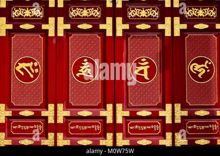 Chinese door in red and gold lacquer with Feng Shui symbols outside a Buddhist temple in Geylang, Singapore Stock Photo