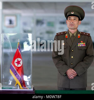 North Korean colonel in front of the armistice document in the North Korea peace museum, North Hwanghae Province, Panmunjom, North Korea Stock Photo
