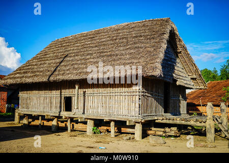 Traditional houses at an ethnic village in Central Highlands of Vietnam. Stock Photo