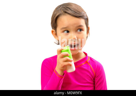 Little sick girl used medical spray for breath Stock Photo